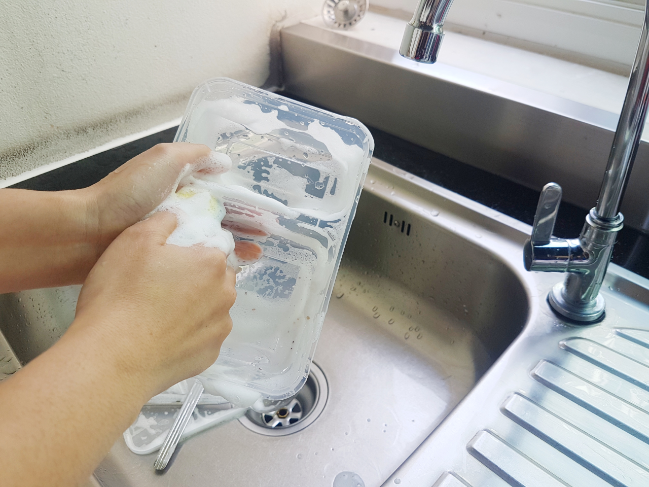 hand washing plastic lunch bento box
