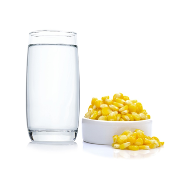 popcorn
kernels next to a glass of water before