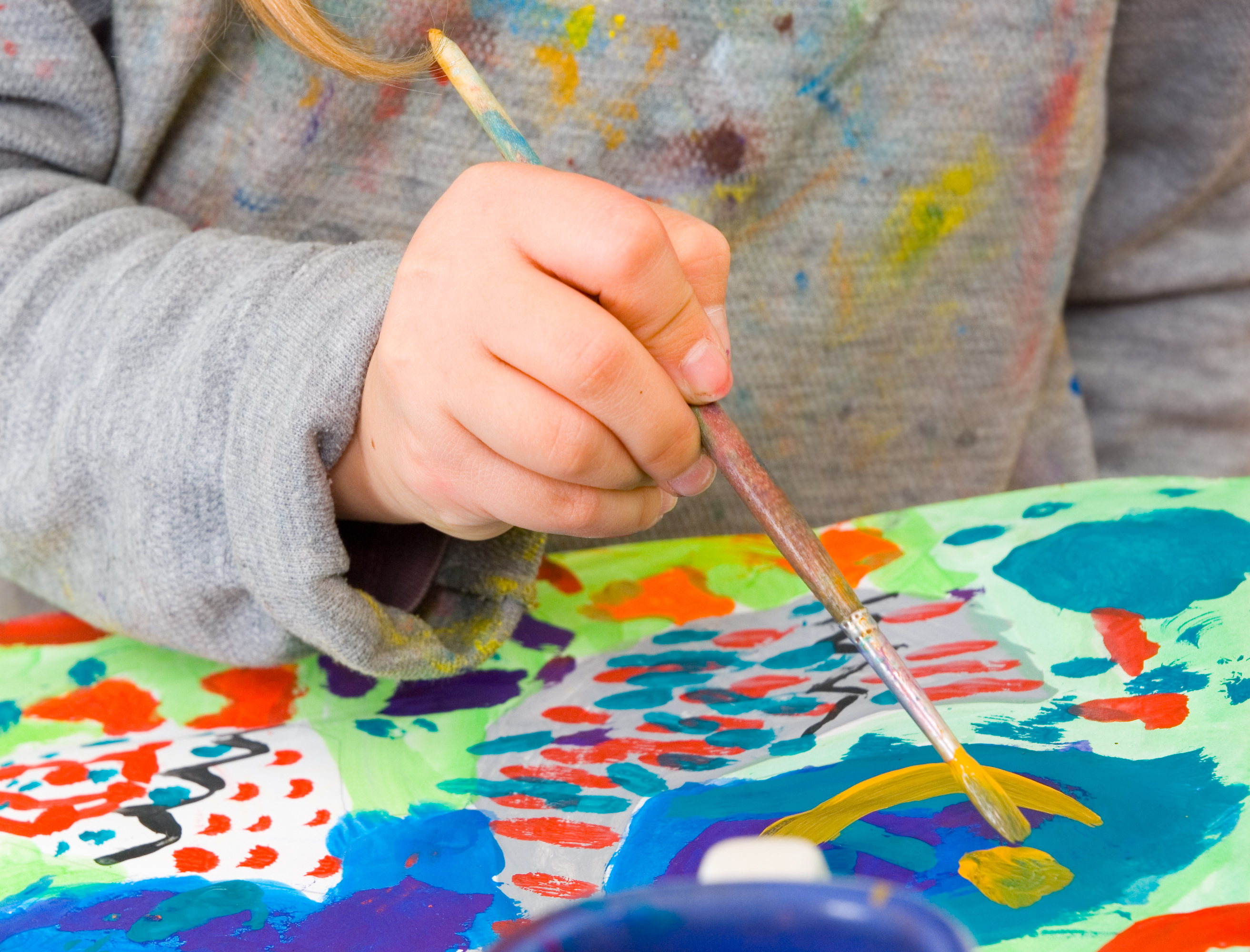child painting with diy baking soda paints