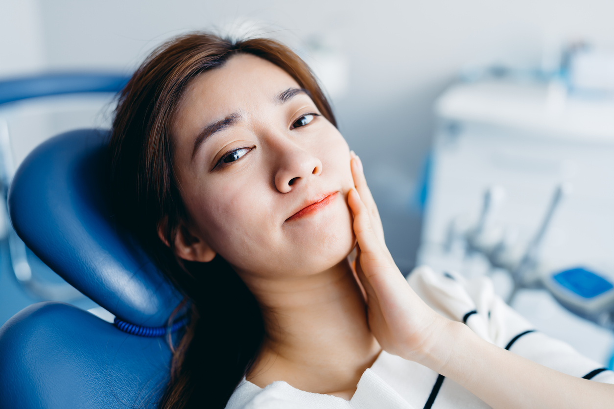 woman at dentist for cavity pain