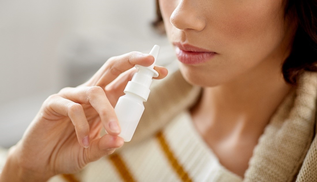 woman with nasal spray how to use simply saline